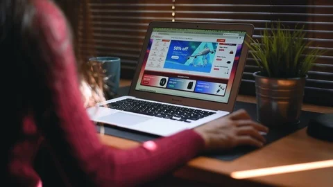 Zoom in Alibaba website on computer laptop. Online shopping at the Alibaba appli Stock Footage 98435622