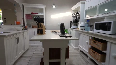 Zoom in and move in on a table setting in a kitchen with some utensils Stock Footage 221431676