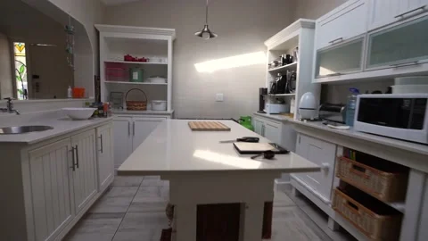 Zoom in and move in on a table setting in a kitchen with some utensils Stock Footage 221431694