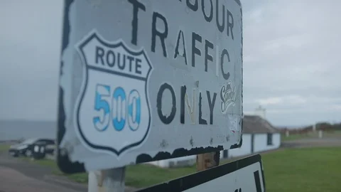 Zoom and Rack focus on Scottish Route 500 sign Stock Footage 104839850