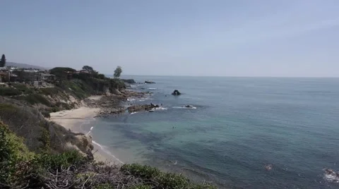 Zoom in on arch rock clear pacific ocean by Corona Del Mar from high cliff. Stock Footage 67601620