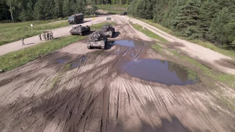 Zoom away from tank column Stock Footage 250979695