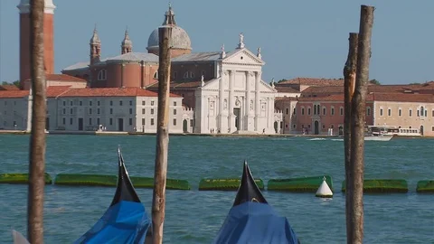 Zoom back from San Giorgio Maggiore to Gondolas on The Grand Canal, Venice Stock Footage 74551447