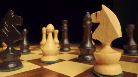 Zoom in between chess knights and other chess pieces Stock Footage 149396617
