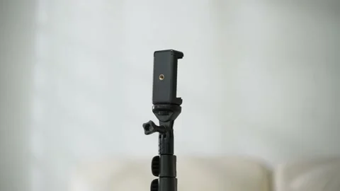 Zoom in black tripod with white background Video stock 163863170