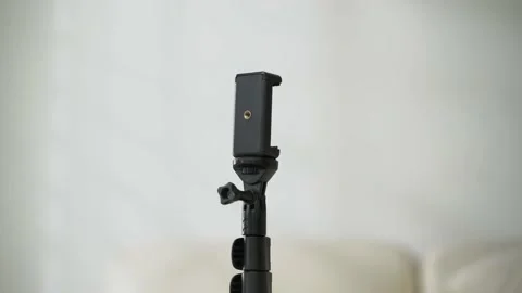 Zoom in black tripod with white background Stock Footage 163863193