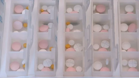 Zoom in to boxes for daily use with pills 스톡 동영상 113755474