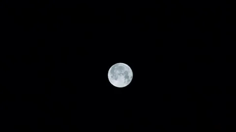 Zoom in bright moon in the night sky Stock Footage 101363463