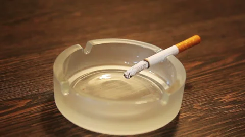 Zoom in of a burning cigarette Stock Footage 34254033