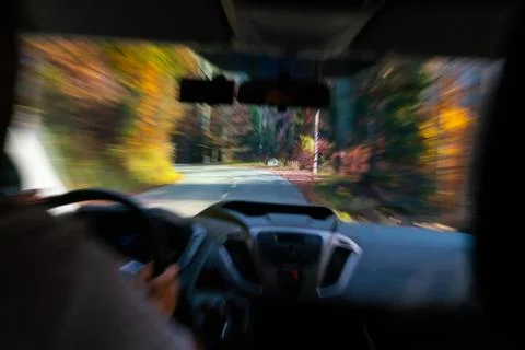 Zoom burst effect while driving down a mountain road Stock Photos