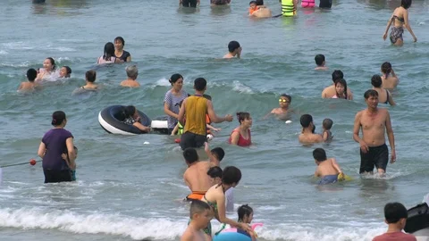 Zoom - Busy Beach Scene in Da Nang Vietnam Stock Footage 87209533