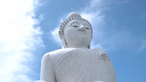 Zoom camera on the face of a big stone Buddha in phuket Stock Footage 120066593