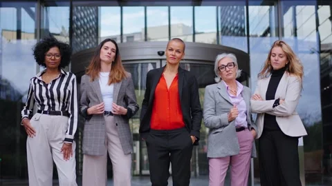 Zoom camera. Group empowered diverse formal business women standing with arms Stock Footage 273969120