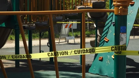 Zoom from caution tape to closed off playground due to Coronavirus. Stock Footage 127256905