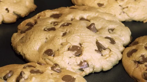 Zoom-in on chocolate chip cookies baking time lapse Stock Footage 910632