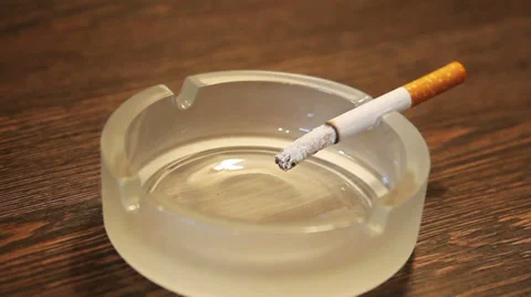 Zoom in of a cigarette Stock Footage 34253811