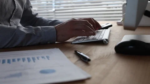 Zoom close up of hands typing on computer keyboard, camera movement Stock Footage 127387328