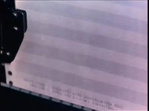 Zoom in to close-up of message printing on teletype machine, 1970s Stock Footage 64820216