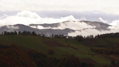Zoom into the clouds over the forests. Hill mountains in Serbia. Stock Footage 256163828