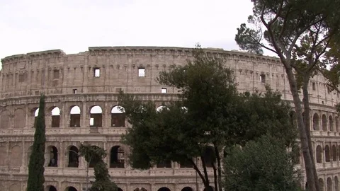 Zoom in to Colosseum  through the trees Stock Footage 72457466