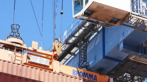 Zoom at Container crane lifts 40 feet shipping container from storage yard   Stock Footage 88860409