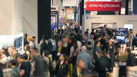 Zoom in on crowds of people at CES 2017 trade show expo. Timelpse. Stock Footage 71840364