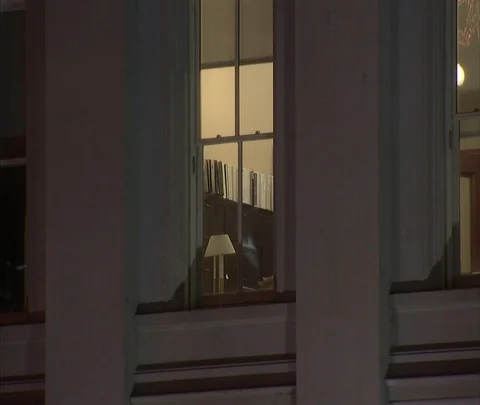 Zoom in to CU office window with light on. Stock Footage 86749965