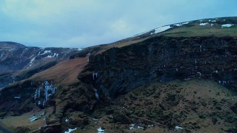 Zoom into dark cave in mountain scene setter Stock Footage 122298334