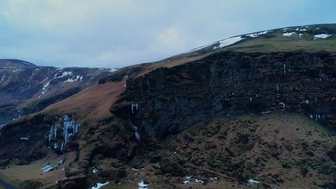 Zoom into dark cave in mountian scene setter Stock Footage 122286477