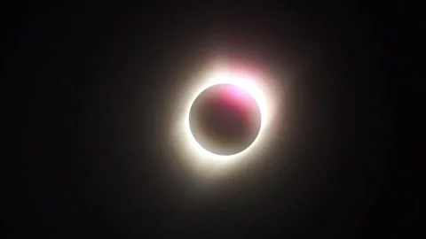 Zoom-in on the diamond ring effect as it explodes to fill the screen with Stock Footage 274041945