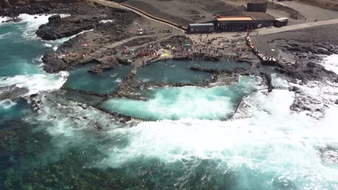 Zoom in from drone point of view of natural pool in the rocky coast of Agae.. Stock Footage 278388105