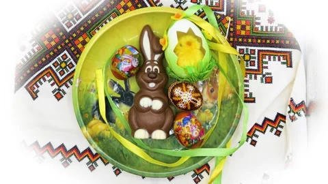 Zoom in to Easter chocolate rabbit with eggs and chicken toy Stock Footage 276312911
