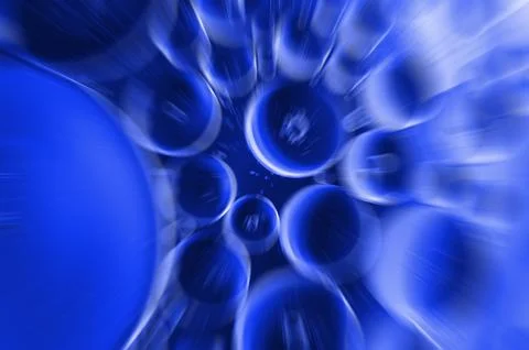 Zoom effect on closeup of bubbles on water surface water in blue gradient c.. Stock Photos