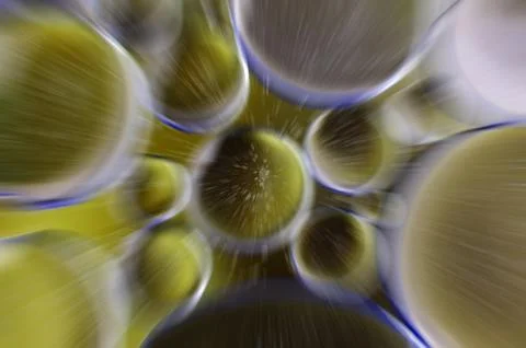 Zoom in effect on closeup of bubbles on water surface water in dark golden .. Stock Photos