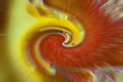 Zoom effect on twirled bubbles on water surface water in yellow and red gra.. Stock Photos