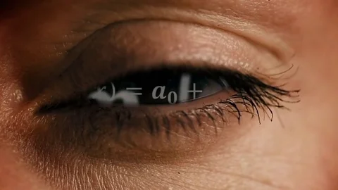 Zoom into eye iris to math equations mess Stock Footage 82530383