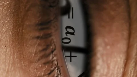 Zoom into eye iris to math equations mess Stock Footage 91162247