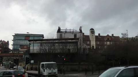 Zoom in to fire damaged building with burned out roof Stock Footage 1102016