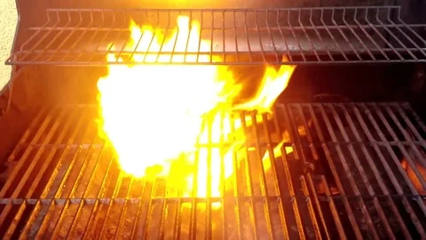 Zoom In - Flames Engulfing a BBQ Grill Stock Footage 77360310