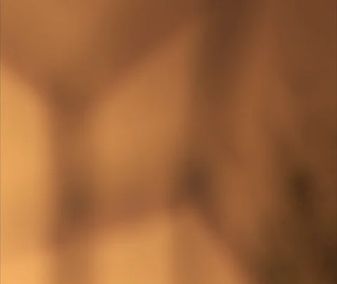 Zoom into focus, and out of focus, slowly turning wind turbines Stock Footage 86743215