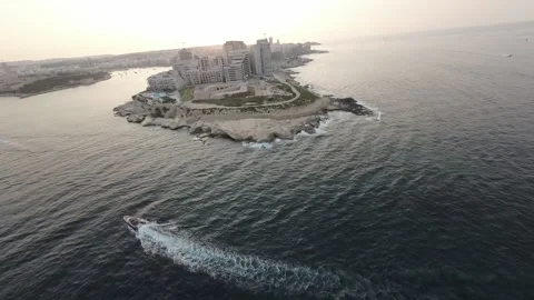 Zoom in FPV drone footage of the seashore near the houses RAW video Stock Footage 248783953