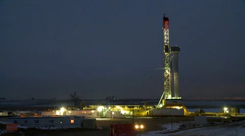 Zoom in on a fracking operation site, at night Stock Footage 47939864