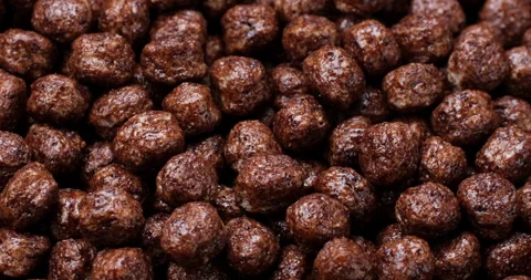 Zoom frame chocolate breakfast cereal top view, rotation Stock Footage 260398000