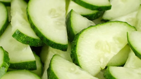 Zoom frame chopped cucumber close up, rotation Stock Footage 247256556