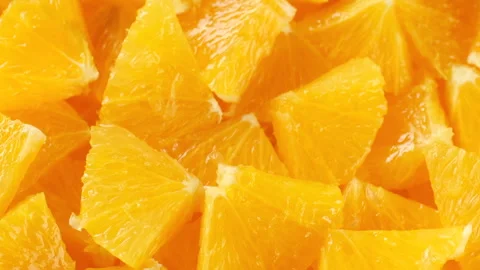 Zoom frame Chopped fresh orange fruit, rotation Stock-Footage 282433016