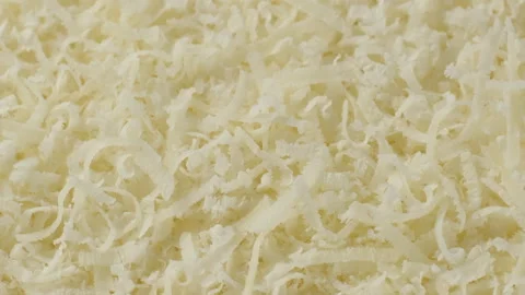Zoom frame grated cheese parmesan, close up Stock Footage 250610161