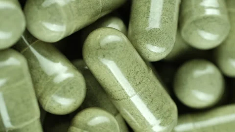 Zoom frame green capsules, vertical video Vídeos de archivo 250308332