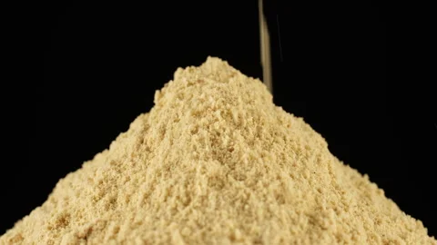 Zoom frame Ground ginger powder, isolated on black background Stock Footage 260394169