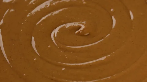 Zoom frame peanut butter close up rotate Video stock 252564053
