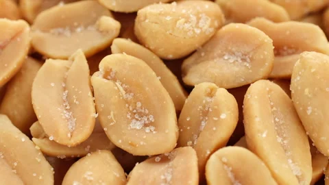 Zoom frame salted roasted peanuts macro, rotate Stock Footage 240463823
